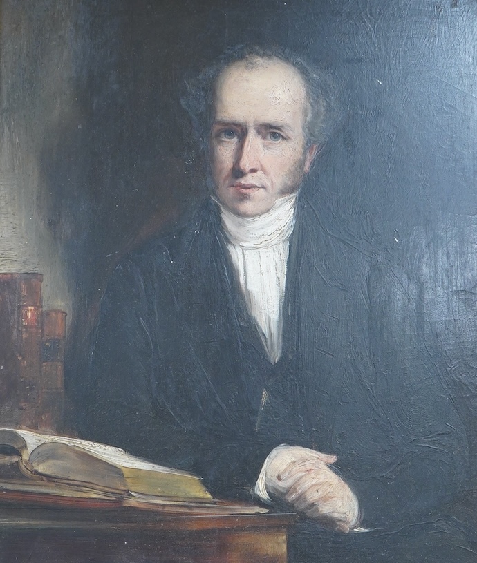 Early 19th century, English School, Portrait of a seated gentleman at a table, oil on board, 34 x 29cm, gilt frame